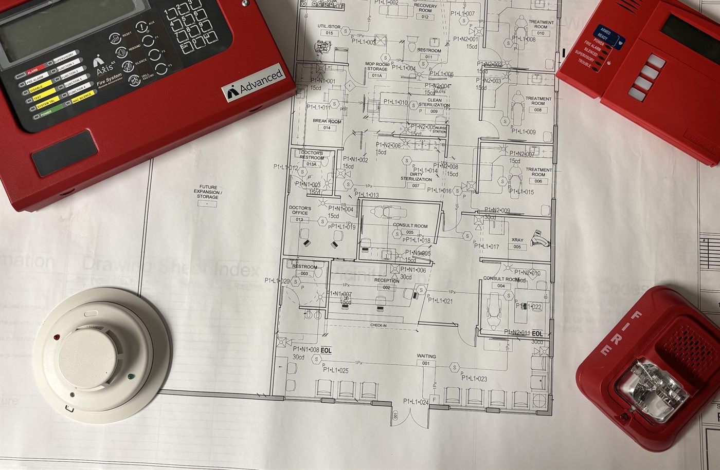 A fire alarm shop drawing laid out with an addressable control panel, a remote annunciator, a smoke detector and a horn/strobe set on top of it